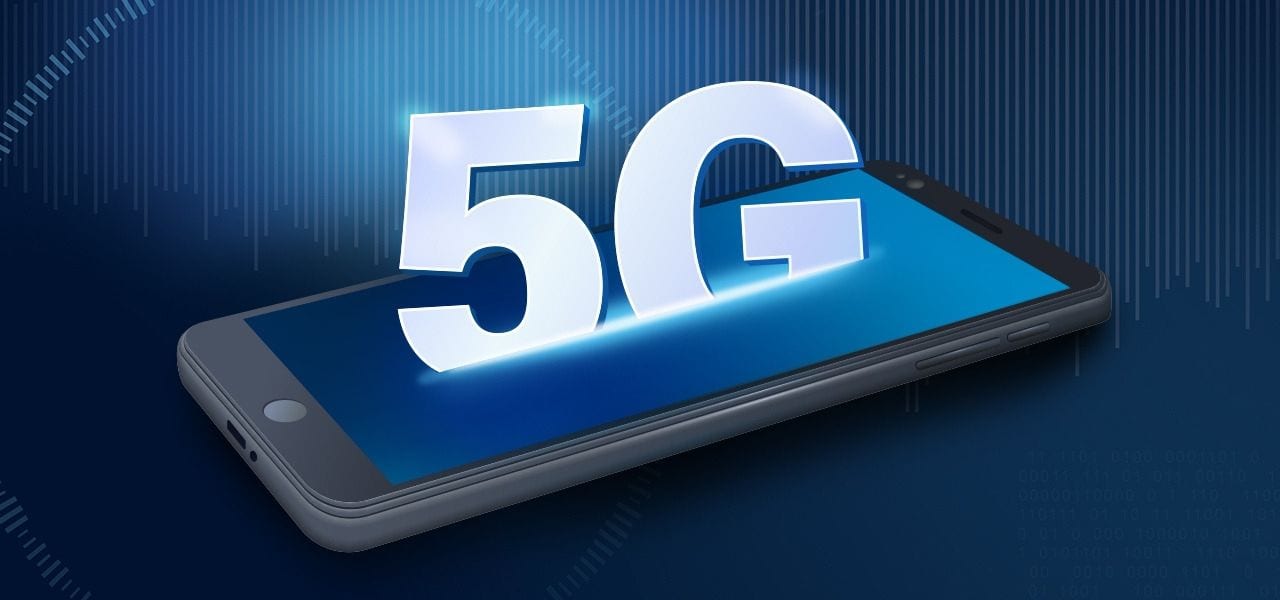 Cell phone on blue background with 5G rising out of the phone