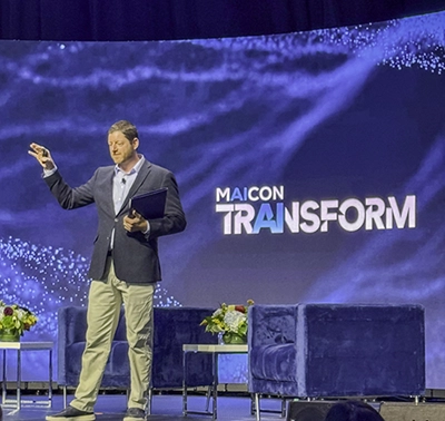 Speaker presenting AI strategy on the MAICON TRANSFORM stage.