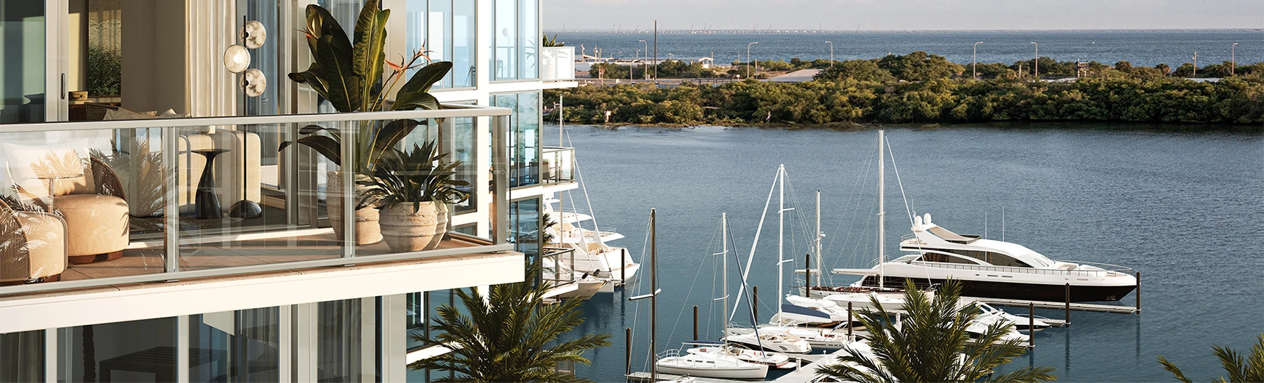 Glass balcony condominiums overlooking a marina with yachts and calm coastal water