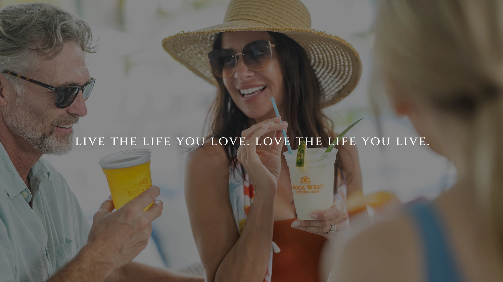 Residents socializing with drinks under the Boca West lifestyle campaign message.