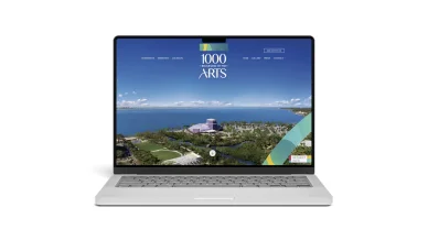 Laptop displaying a waterfront real estate website homepage
