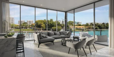 Gray couches and chairs in living room of Bijou Bay Harbor, a Cotton & Company client